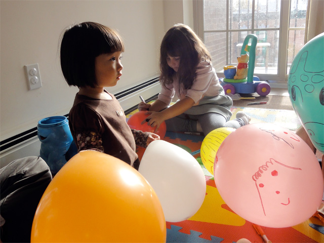Hana was dubious about drawing on the balloons at first